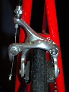 front handbrake on a red bicycle